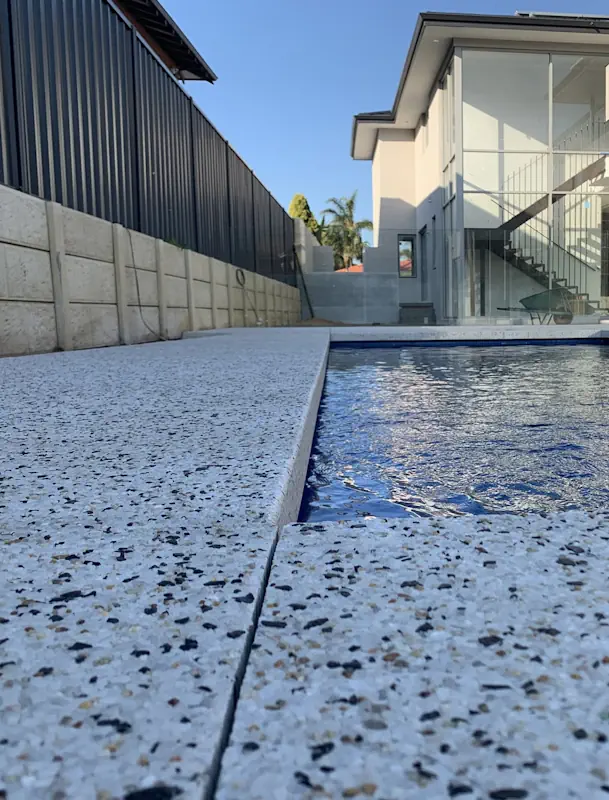 Pool deck exposed aggregate concrete resurfacing in Perth